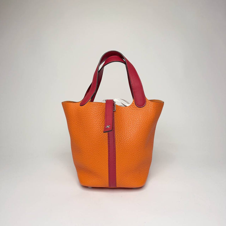 Hermès Picotin Lock Eclat in orange Taurillon Clemence with dark red contrast handles, front view