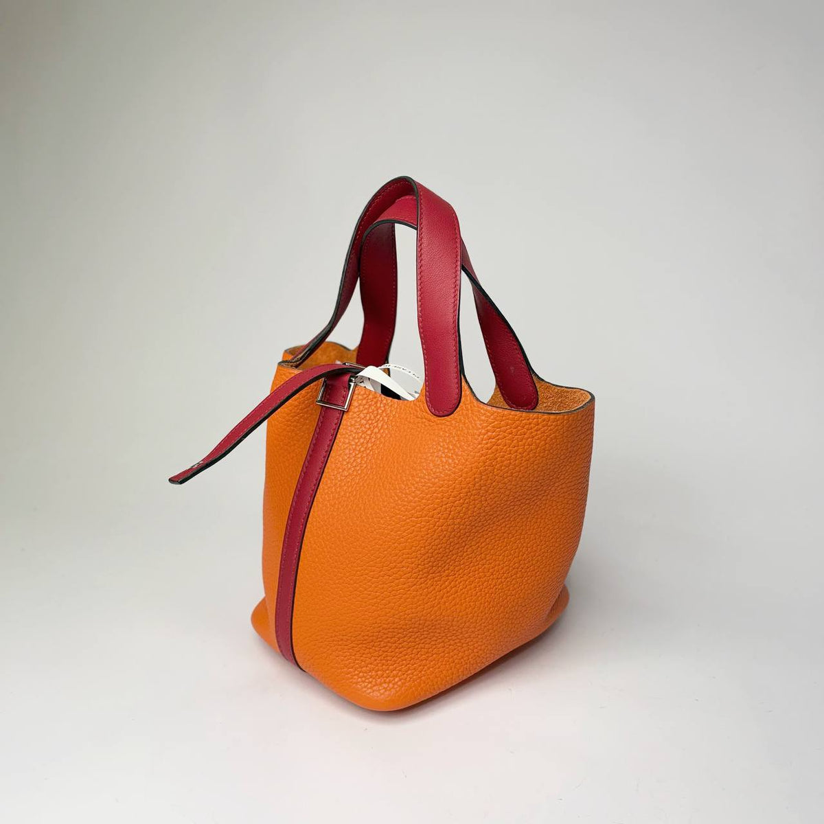 Hermès Picotin Lock Eclat orange, side view with dark red strap