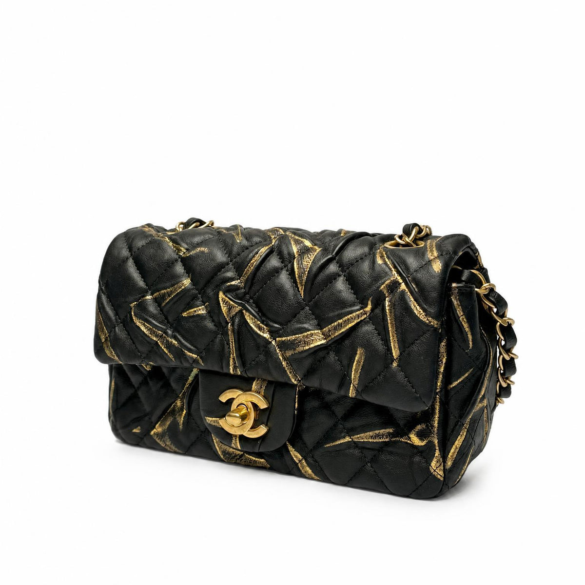 Chanel Mini Rectangular Flap Bag black and gold, angled side view