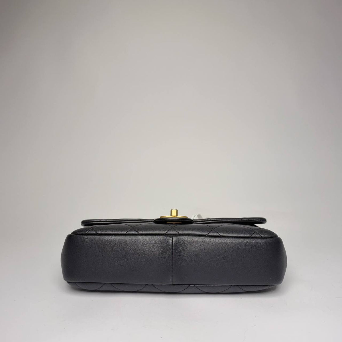 Chanel quilted flap bag black lambskin, base view
