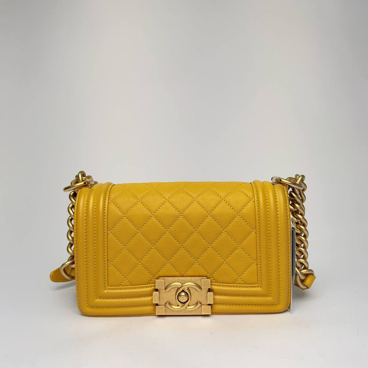 Chanel Boy Bag in yellow quilted leather with brushed gold-tone Boy clasp, front view