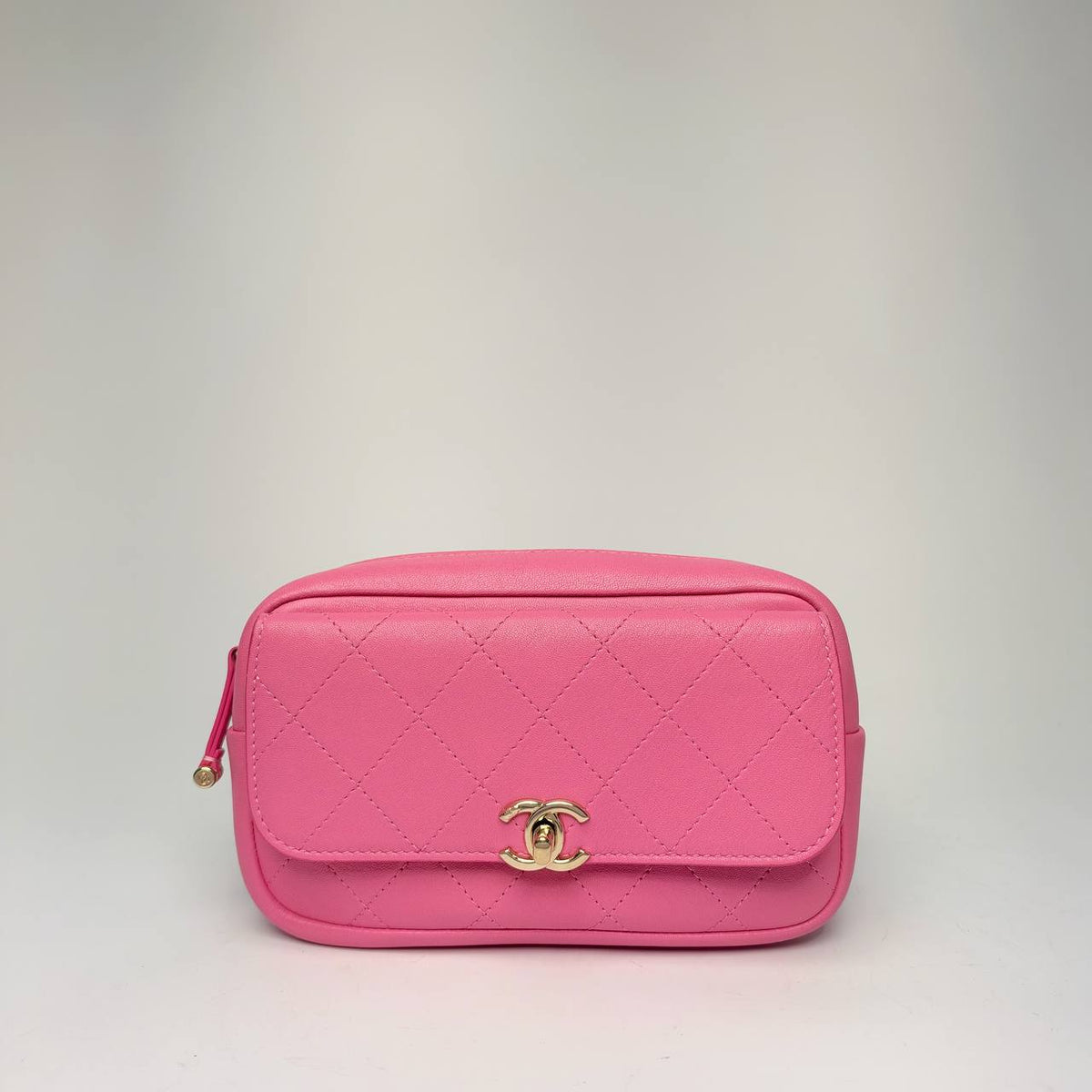 Chanel Casual Trip Waist Bag in pink quilted goatskin with CC turnlock flap pocket, front view