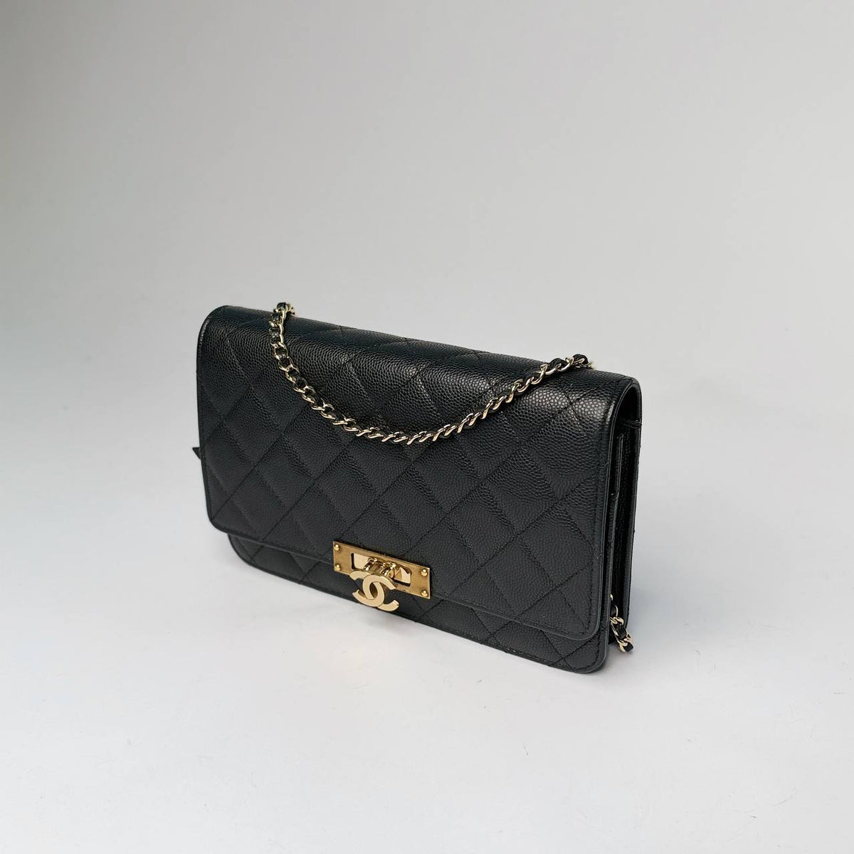 Chanel Golden Class Wallet on Chain black caviar, three-quarter side view with chain strap