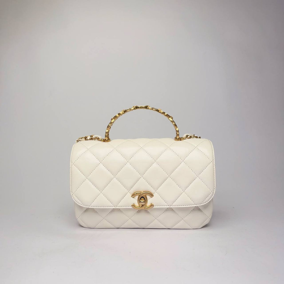 Chanel Small Top Handle Flap Bag in white quilted lambskin with gold CC chain handle, front view