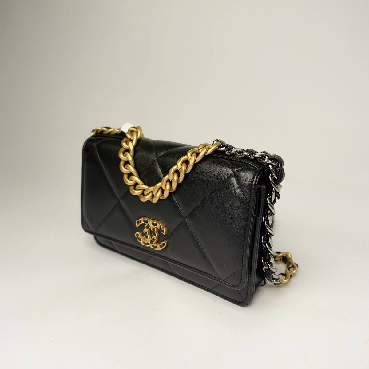 Chanel 19 Wallet on Chain black, angled side view with mixed-metal chain
