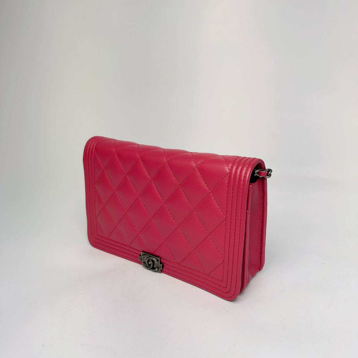 Chanel Boy Wallet on Chain pink, angled side view with chain attachment