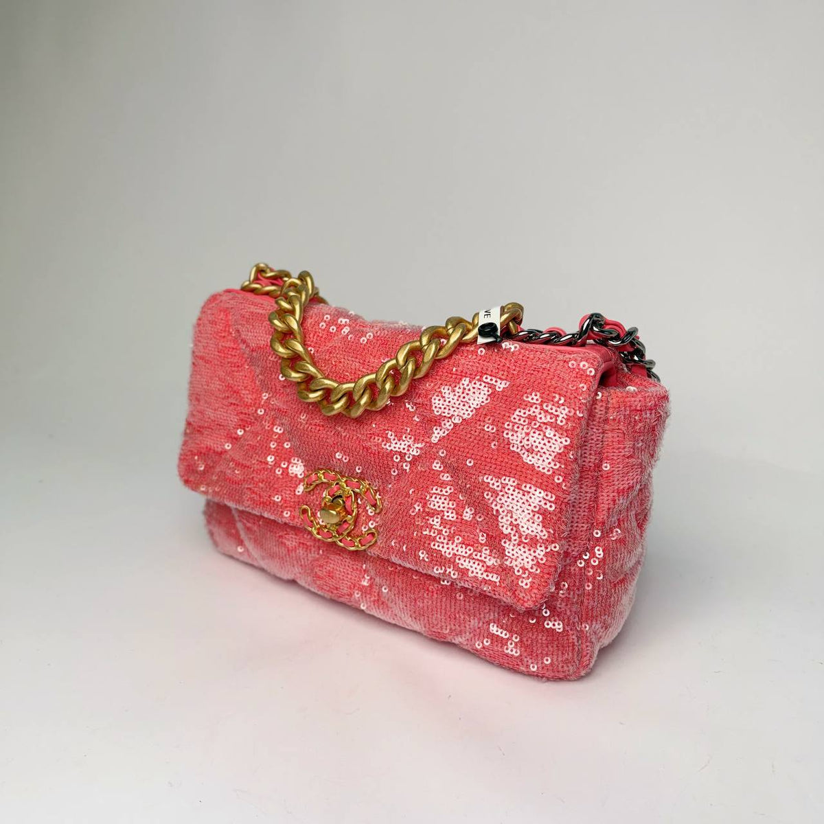 Chanel 19 Flap Bag coral pink sequin, angled side view