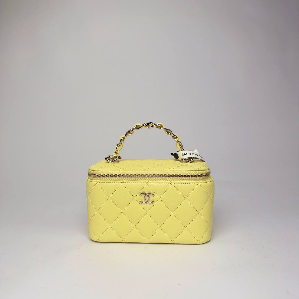 Chanel Top Handle Vanity Case with Chain in yellow quilted lambskin with light gold-tone CC, front view