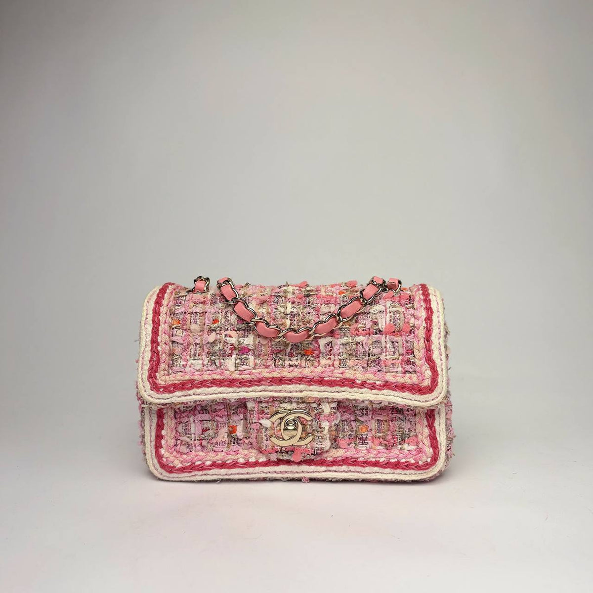 Chanel Mini Rectangular Flap Bag in pink tweed with braided trim and light gold-tone CC, front view