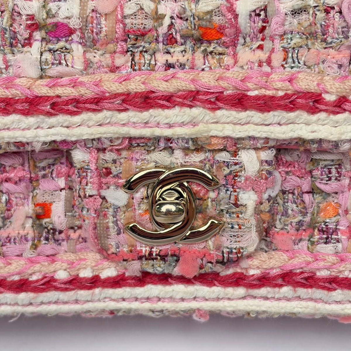 Chanel Mini Rectangular Flap Bag pink tweed, close-up of CC turnlock and braided trim