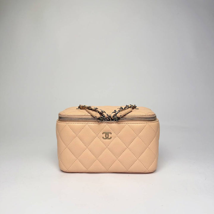 Chanel Small Vanity Case with Chain in light beige quilted caviar leather with gold hardware, front view