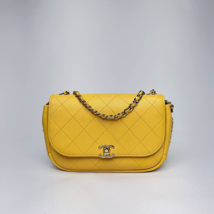 Chanel Casual Trip Flap Bag in yellow quilted leather with leather-woven chain, front view