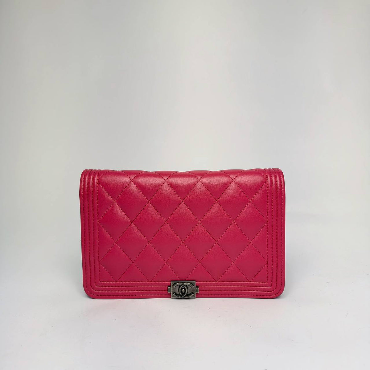 Chanel Boy Wallet on Chain in raspberry pink quilted leather with antique silver-tone Boy clasp, front view