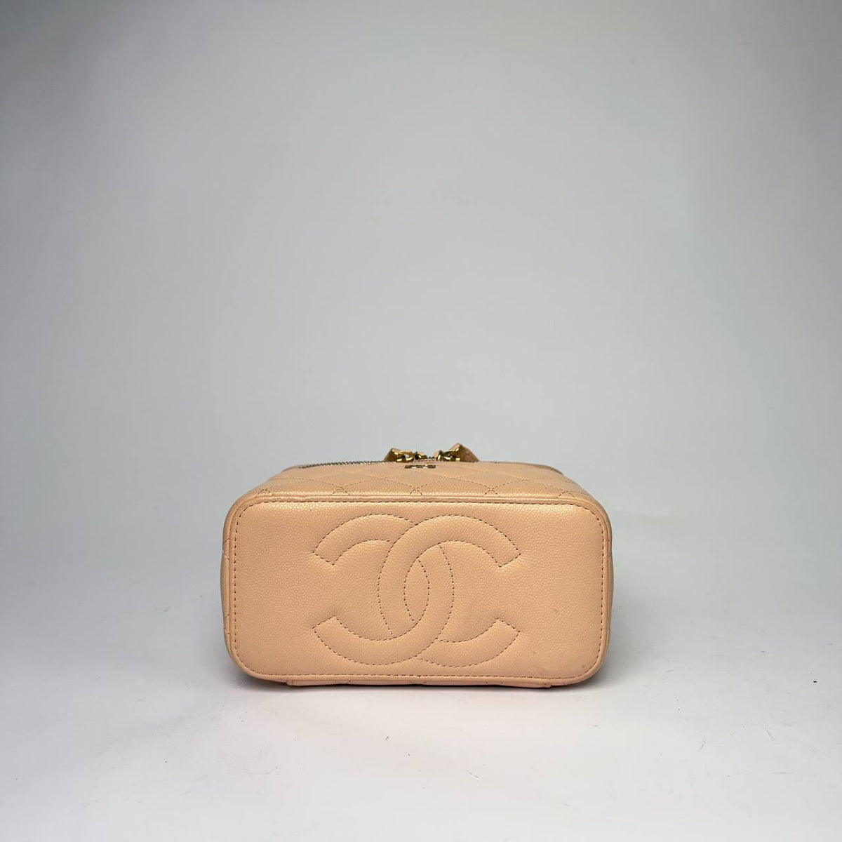 Chanel Small Vanity Case light beige, end view with large stitched CC logo