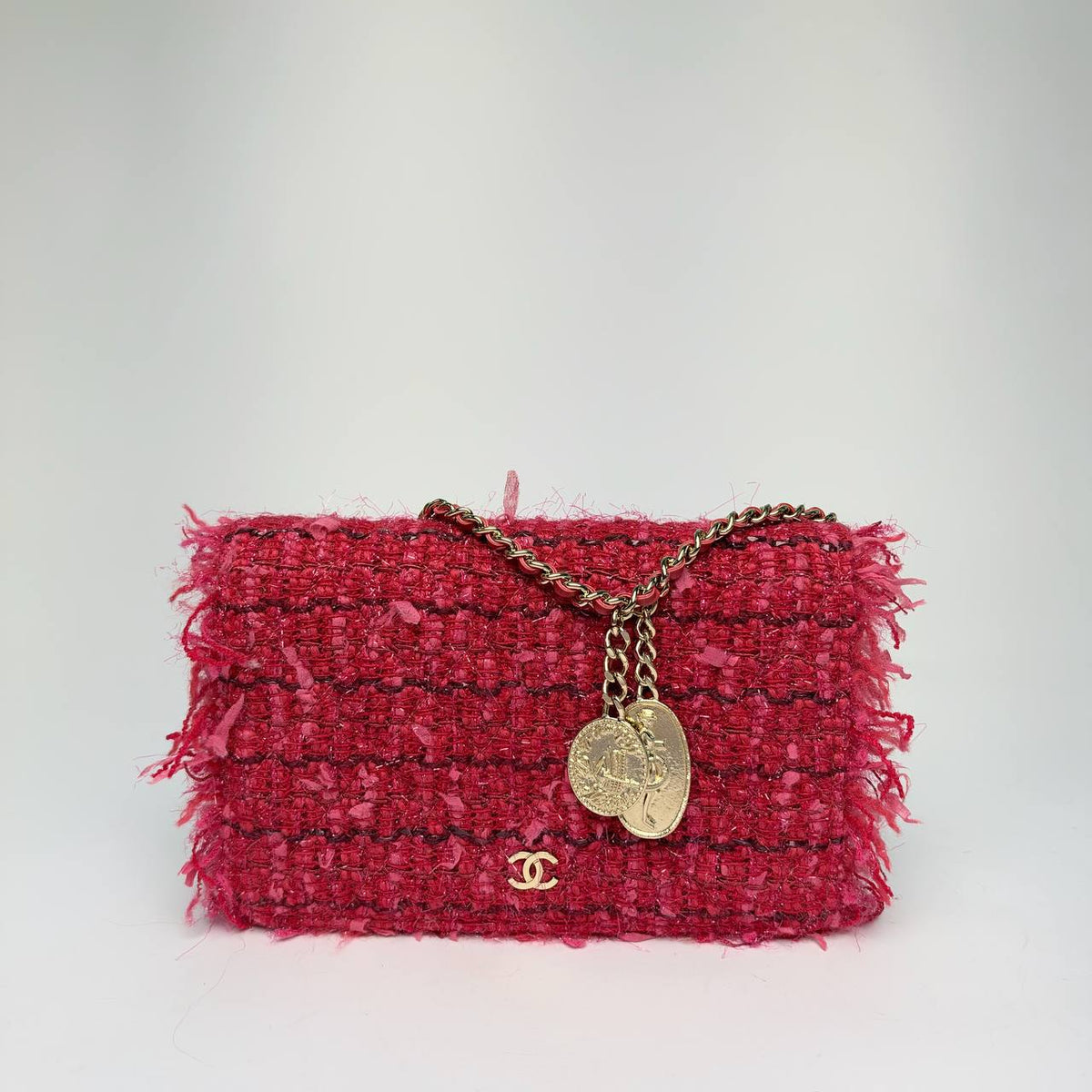 Chanel Tweed Wallet on Chain in red and pink fringed tweed with two coin charms, front view