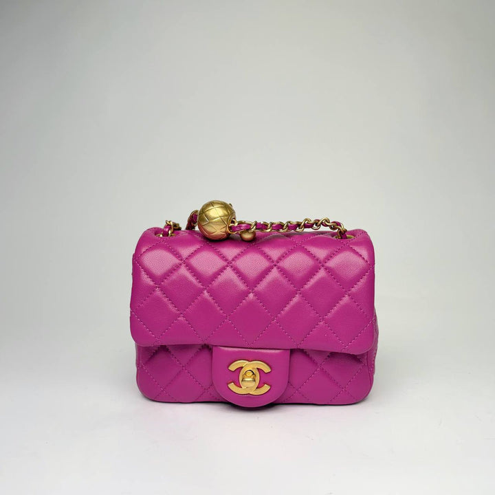 Chanel Pearl Crush Mini Square Flap Bag in purple quilted leather with gold hardware, front view