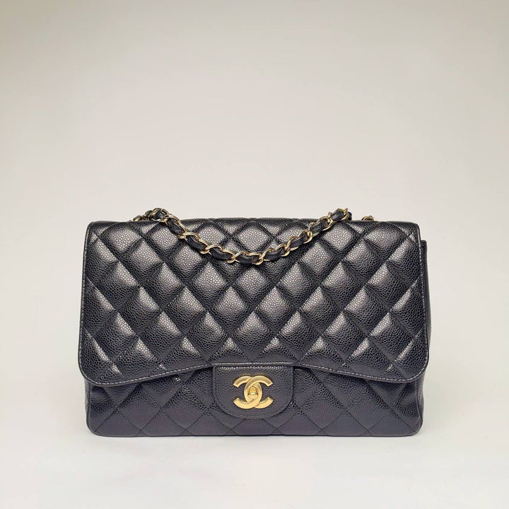 Chanel Jumbo Single Flap Bag in black quilted caviar leather with gold hardware, front view