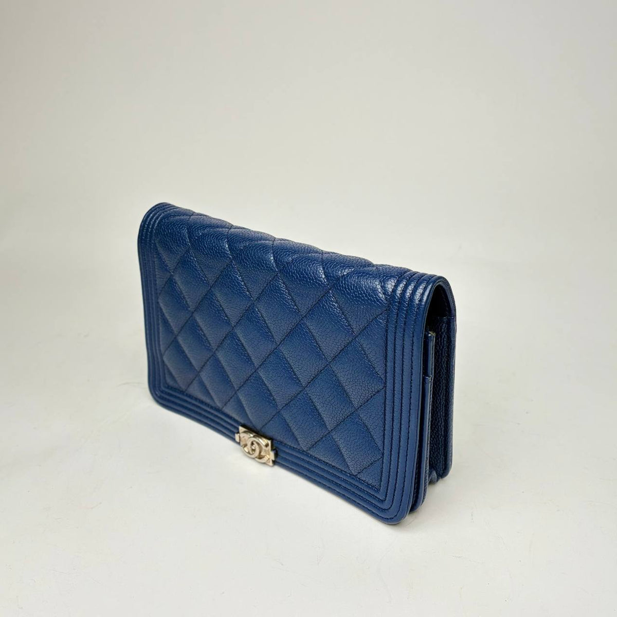 Chanel Boy Wallet blue caviar, angled side view