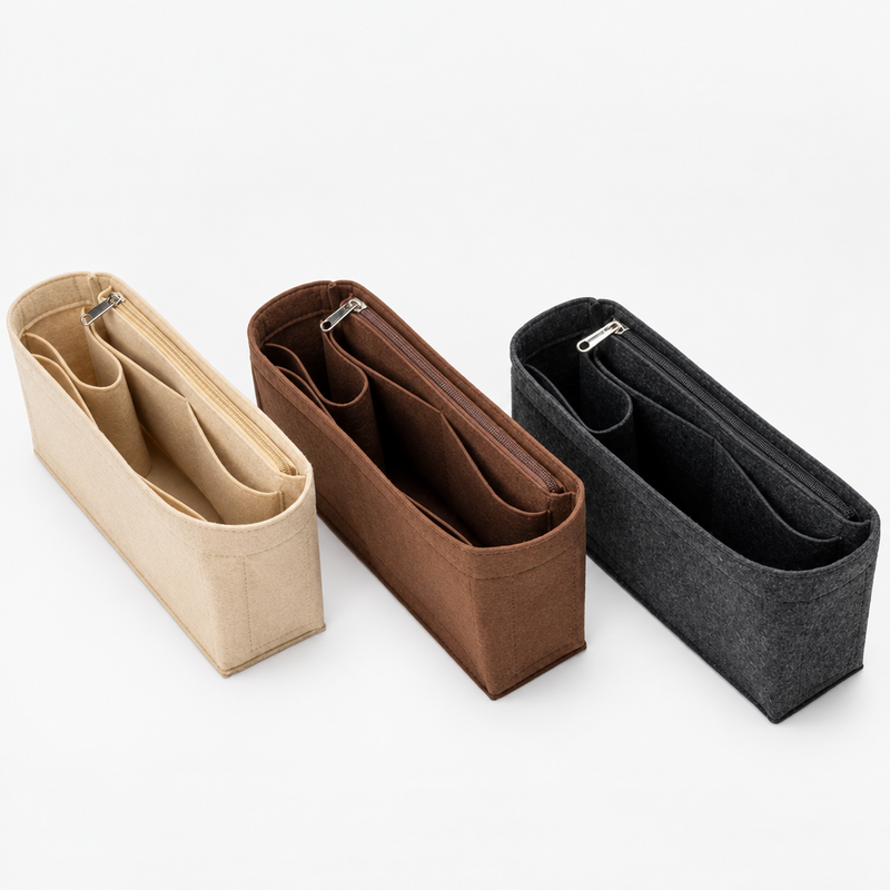 Beige, coffee and charcoal felt organizer inserts for Hermès Herbag 31, angled view of the zipper pockets
