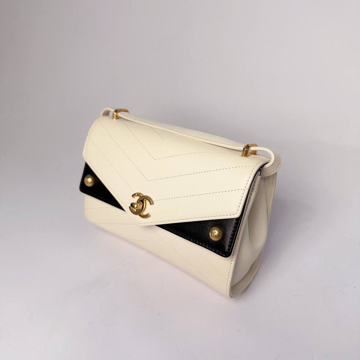 Chanel Chevron Envelope Flap Bag white and black, angled side view