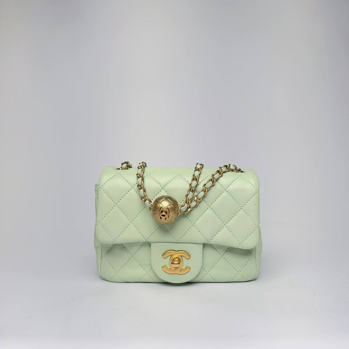 Chanel Pearl Crush Mini Flap Bag in light green quilted leather with gold-tone hardware, front view